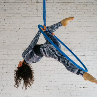 young-woman-is-engaged-in-aerial-acrobatics-on-a-w-2024-11-25-21-44-04-utc